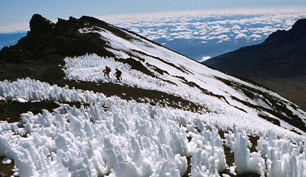 Image to display walking on the trails of Mount Kilimanjaro